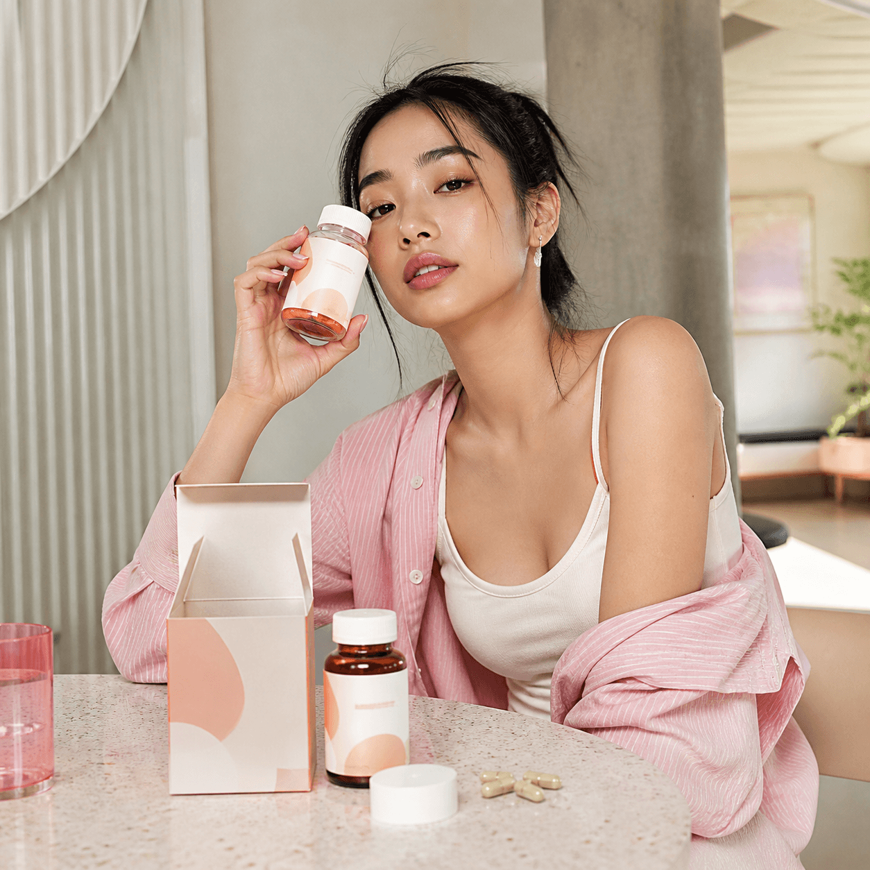 Asian creator with product — Asia market launch